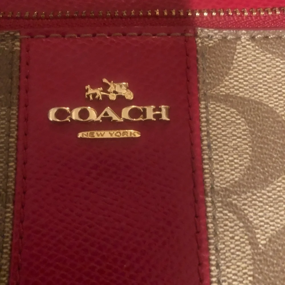 Coach red monogram large zip accordion style wallet with wrist strap